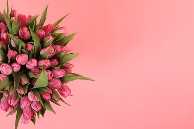 Photo of Bouquet of beautiful tulips on pink background, top view. Space for text