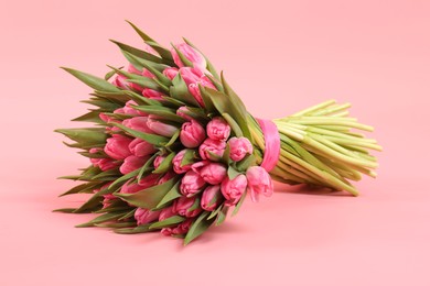 Photo of Bouquet of beautiful tulips on pink background