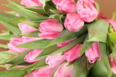 Photo of Bouquet of beautiful tulips on blurred background, closeup