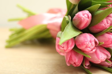 Photo of Bouquet of beautiful tulips on table, closeup. Space for text