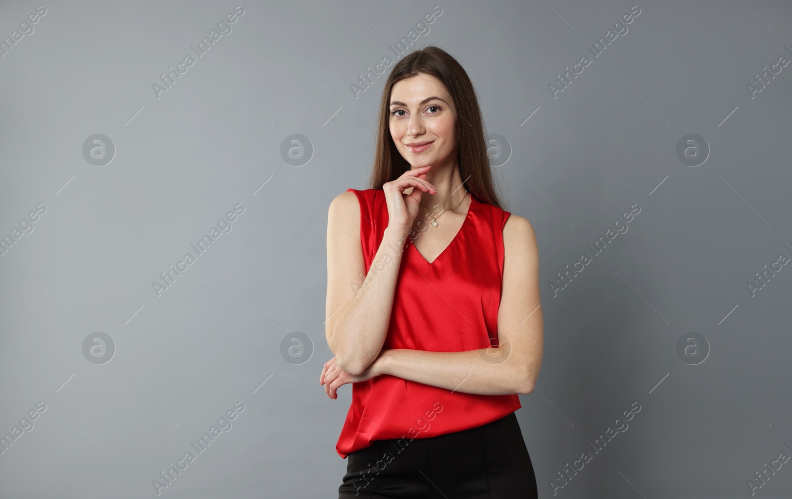 Photo of Beautiful woman in stylish outfit on grey background