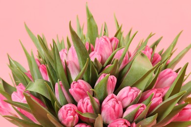 Bouquet of beautiful tulips on pink background, closeup