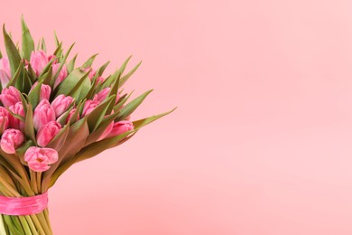 Photo of Bouquet of beautiful tulips on pink background, closeup. Space for text