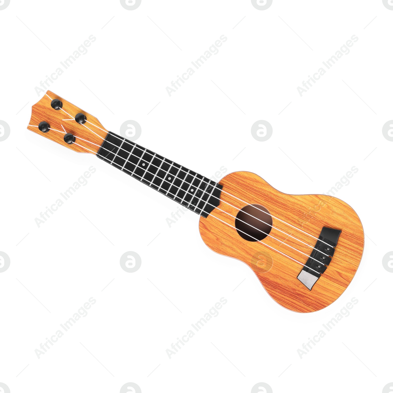 Photo of Wooden toy guitar isolated on white, top view. Child's musical instrument