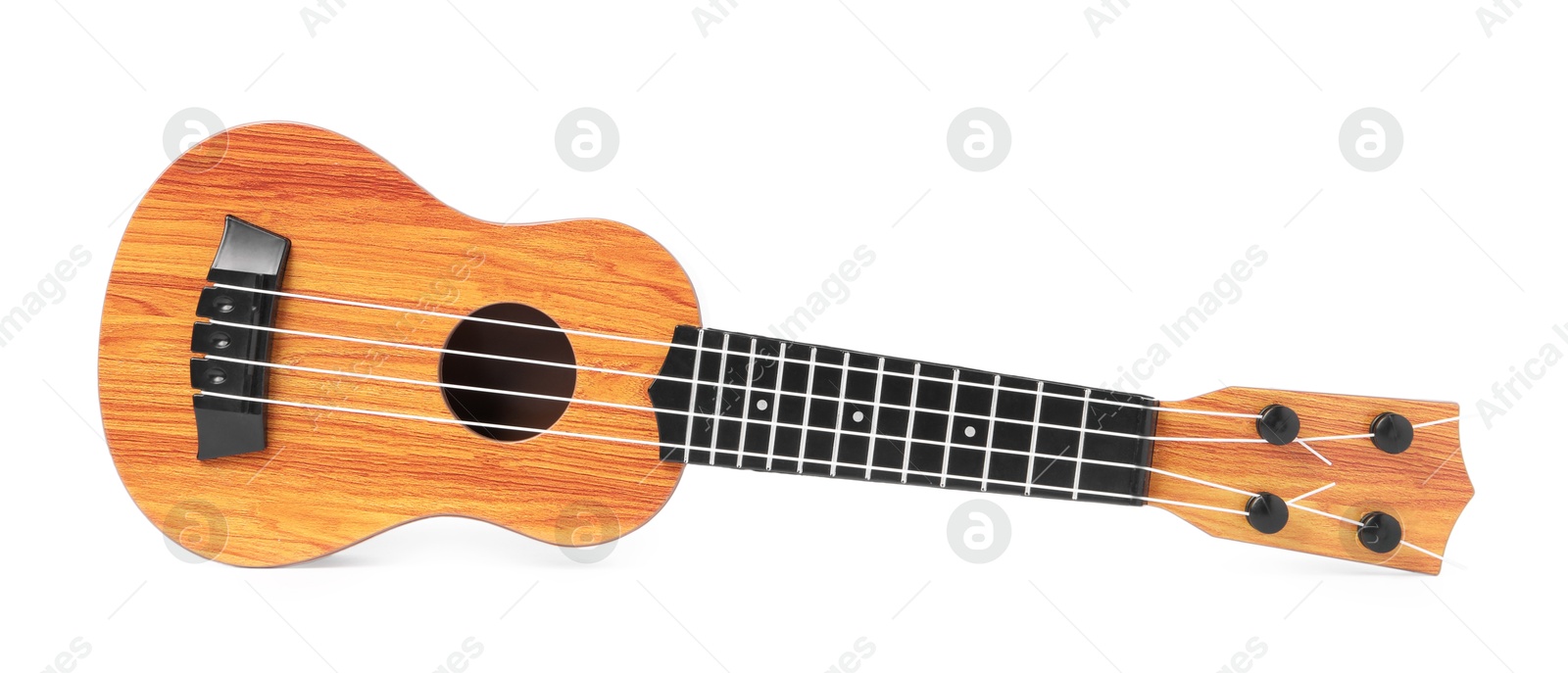 Photo of Wooden toy guitar isolated on white. Child's musical instrument