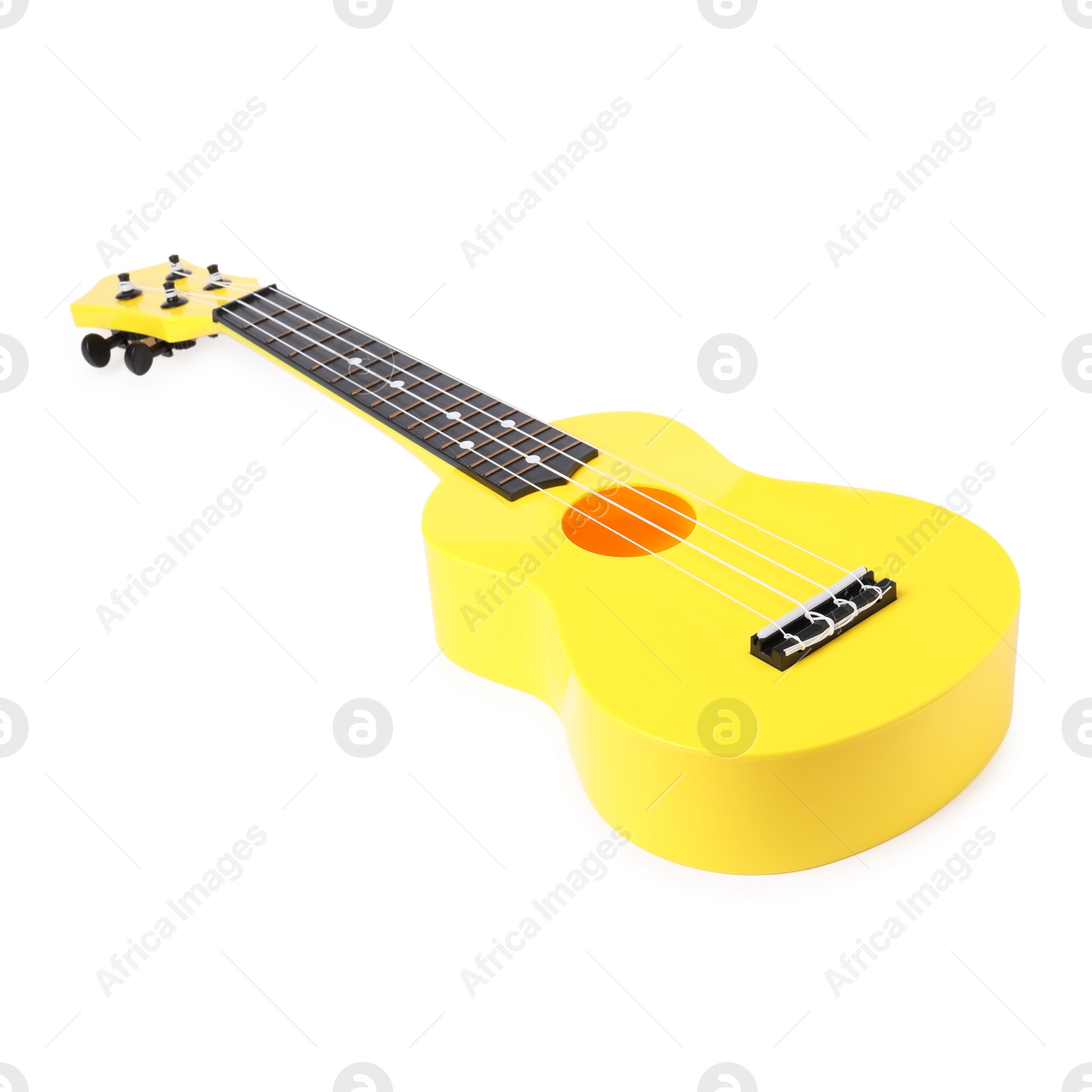 Photo of Yellow toy guitar isolated on white. Child's musical instrument