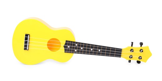 Photo of Yellow toy guitar isolated on white. Child's musical instrument