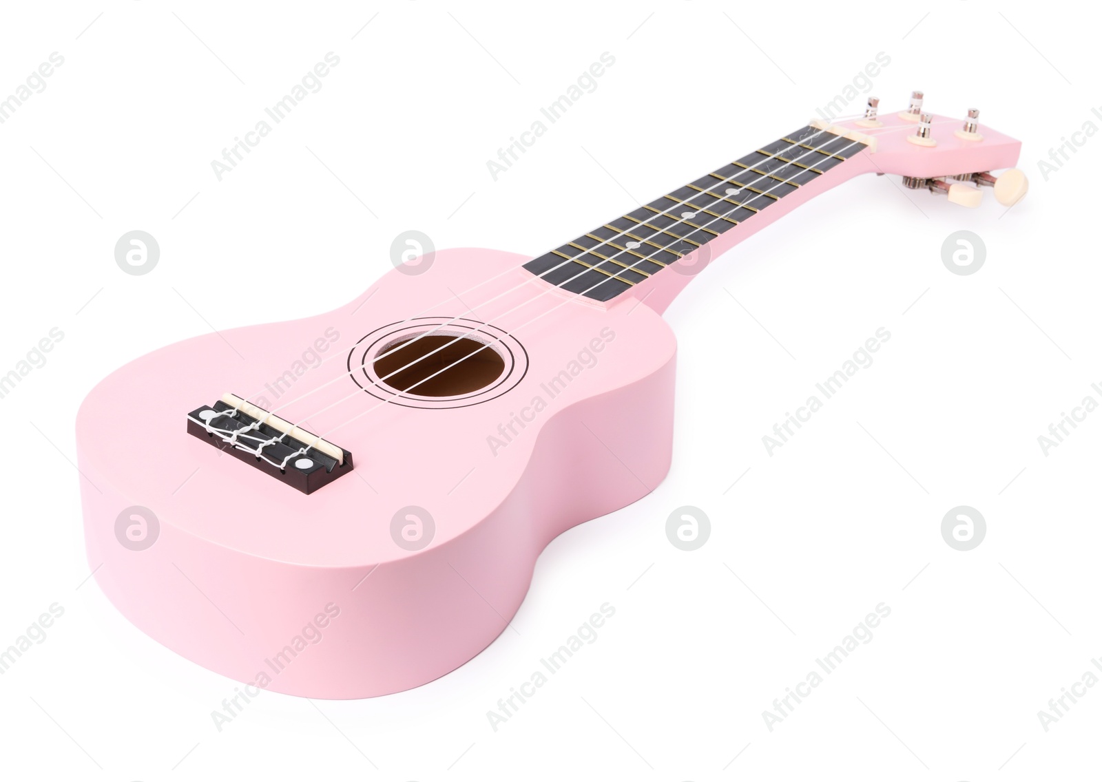 Photo of Pink toy guitar isolated on white. Child's musical instrument