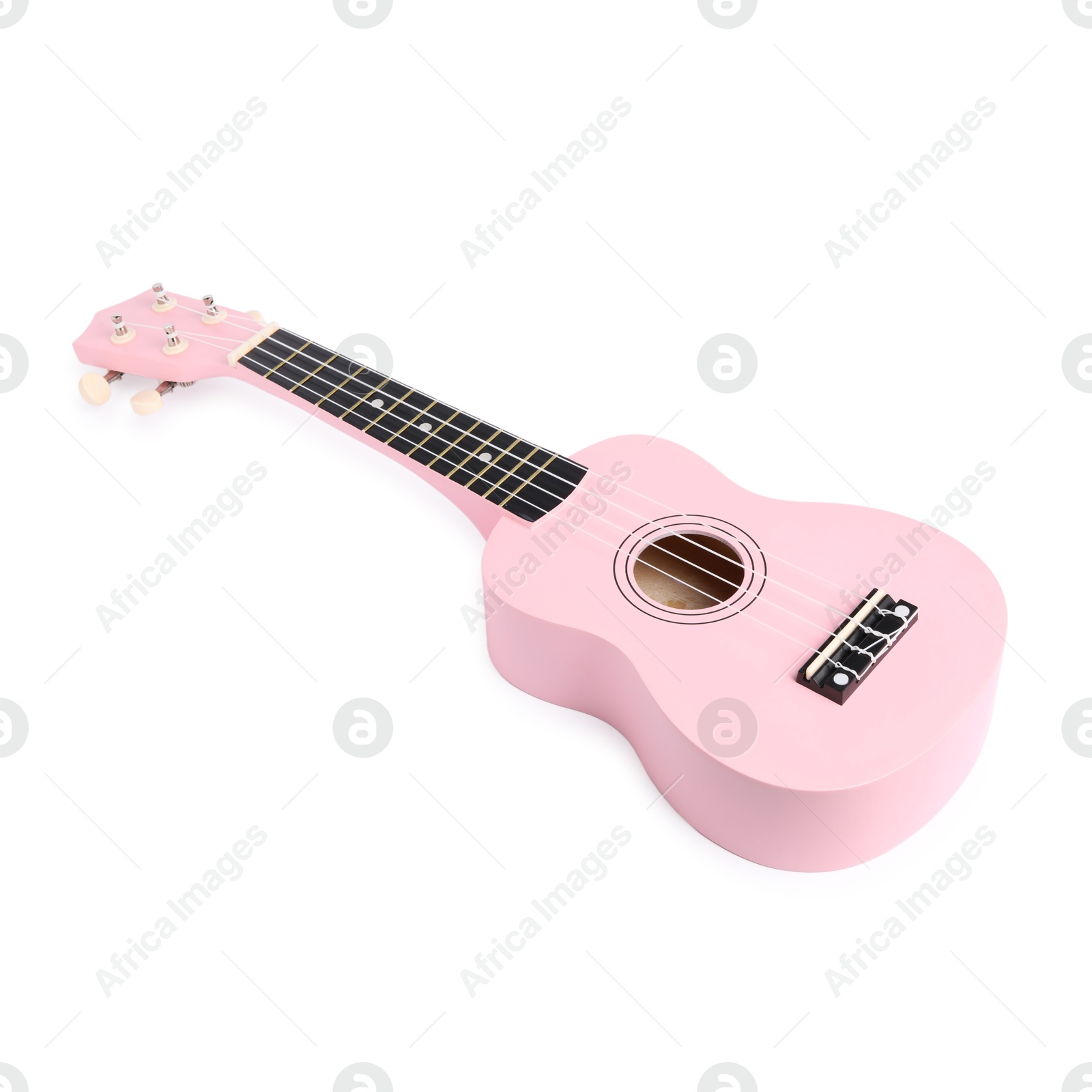 Photo of Pink toy guitar isolated on white. Child's musical instrument