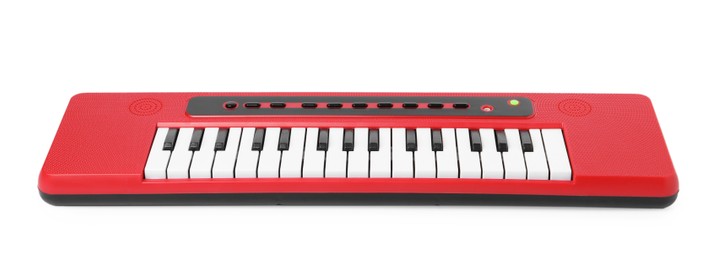 Photo of Red toy electric piano isolated on white