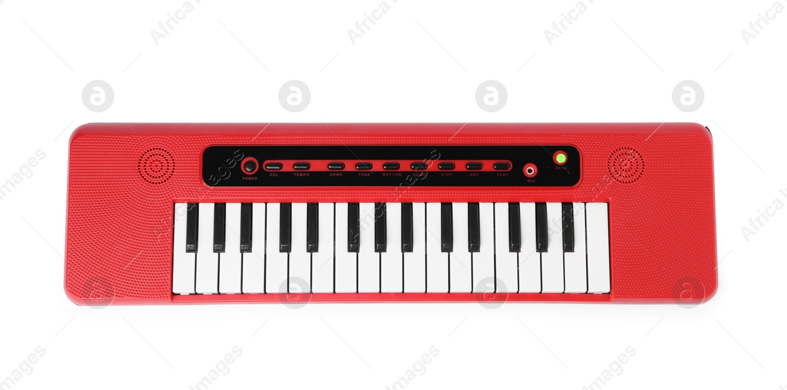 Photo of Red toy electric piano isolated on white, top view