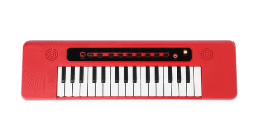 Photo of Red toy electric piano isolated on white, top view