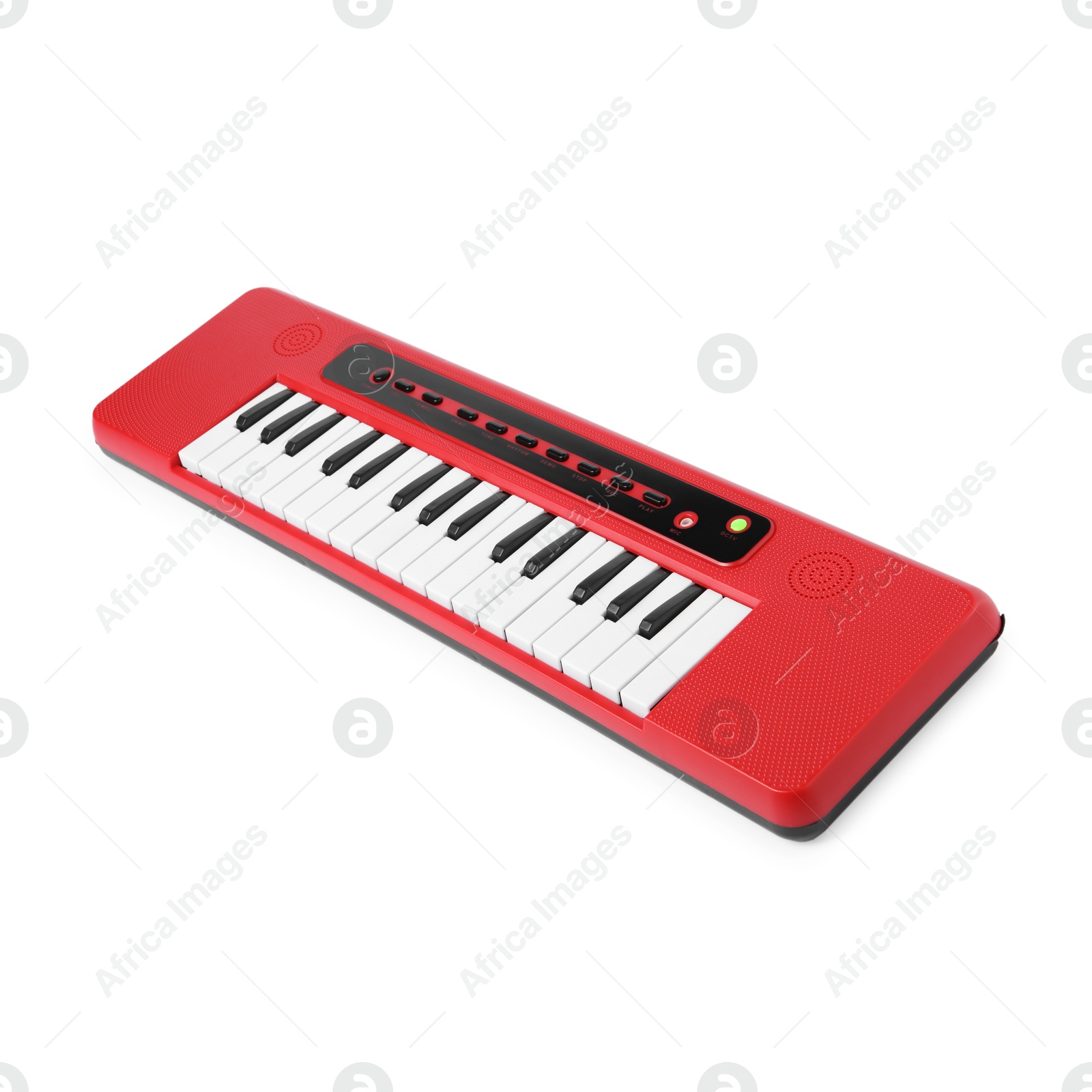 Photo of Red toy electric piano isolated on white