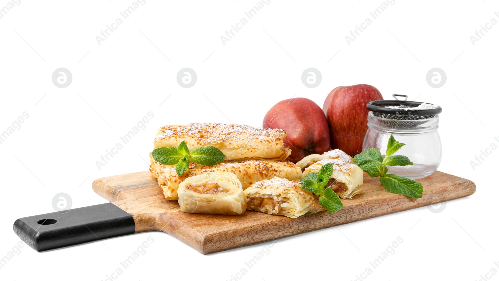 Photo of Tasty apple strudels with powdered sugar, fruits and mint isolated on white