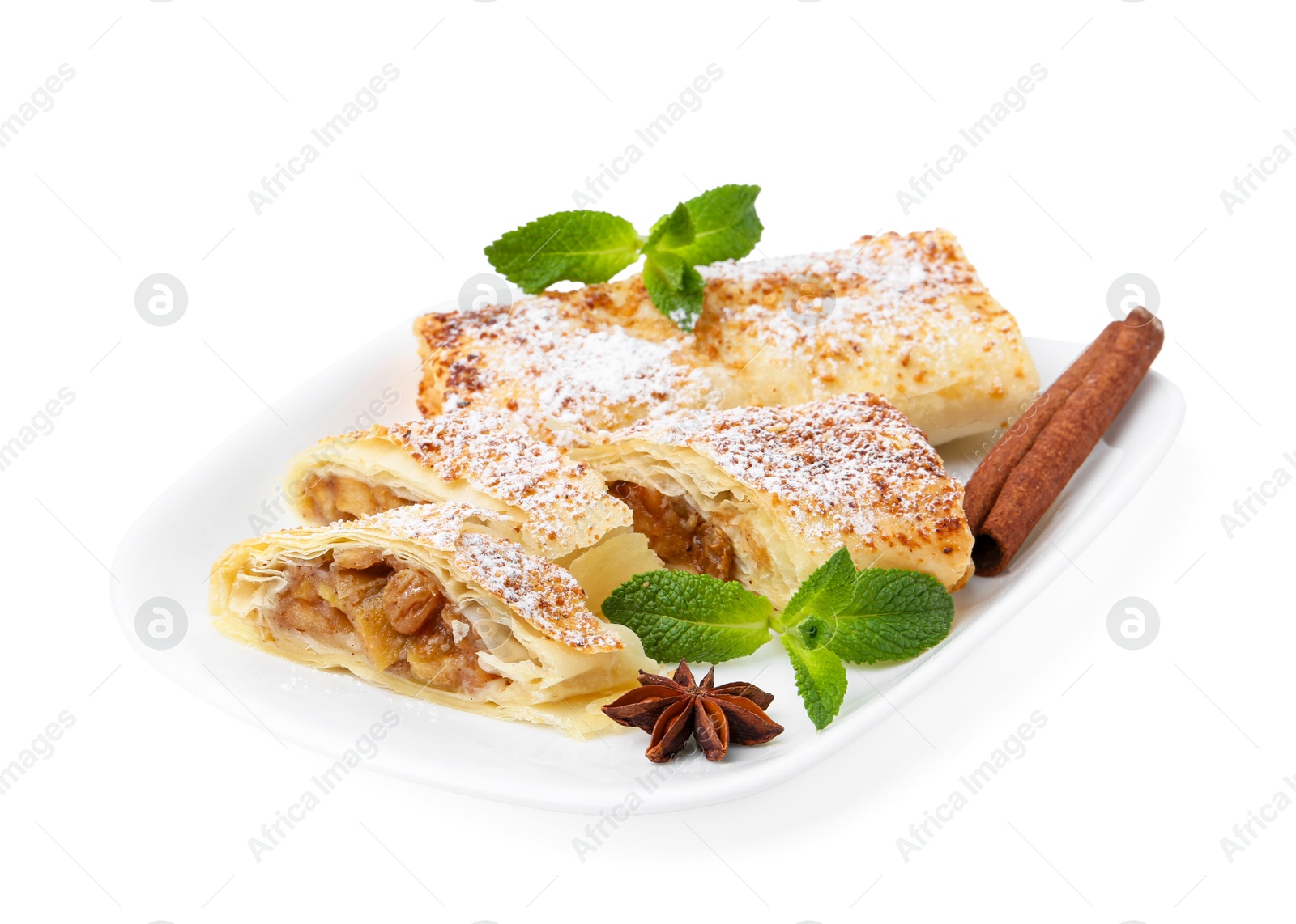 Photo of Tasty apple strudels with powdered sugar, mint and spices isolated on white