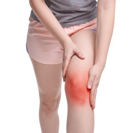 Image of Young woman suffering from pain in knee on white background, closeup