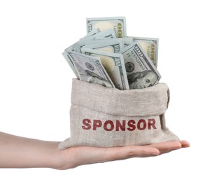 Image of Woman holding sack with word Sponsor full of dollar banknotes on white background, closeup