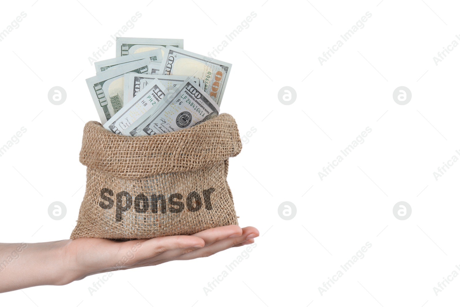 Image of Woman holding sack with word Sponsor full of dollar banknotes on white background, closeup