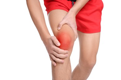 Image of Young man suffering from pain in knee on white background, closeup