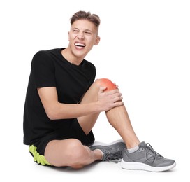 Young man suffering from pain in knee on white background