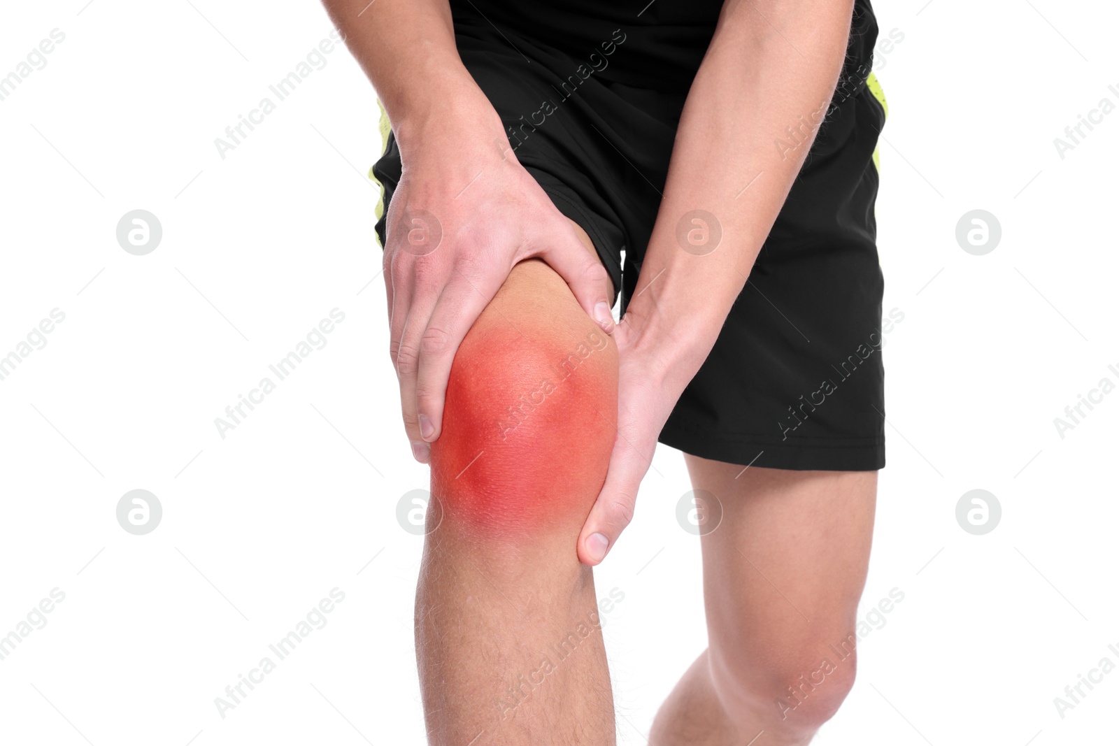 Image of Young man suffering from pain in knee on white background, closeup