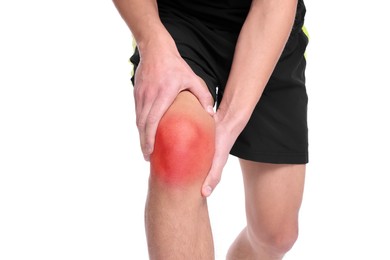 Image of Young man suffering from pain in knee on white background, closeup