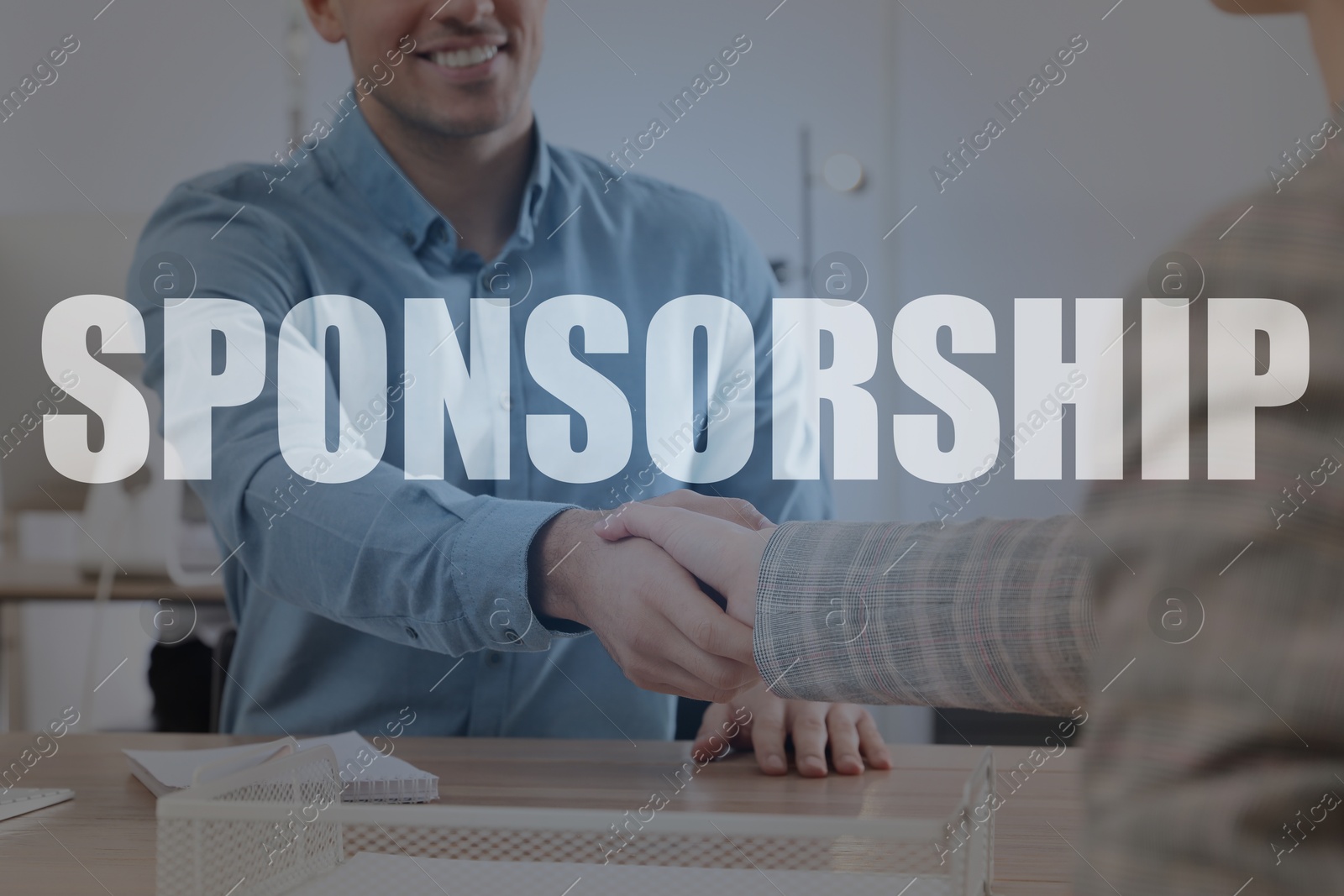 Image of Sponsorship. People shaking hands in office, closeup