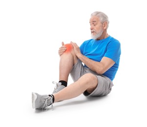 Senior man suffering from pain in knee on white background