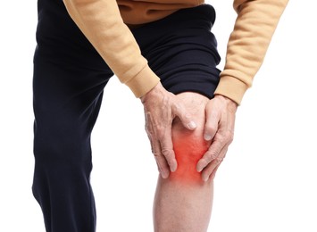 Image of Senior man suffering from pain in knee on white background, closeup