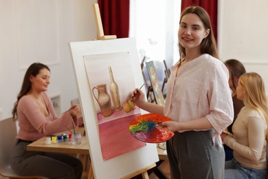 Group of women learning to draw in class