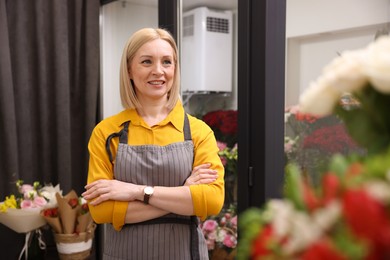 Photo of Business owner with crossed arms in her flower shop