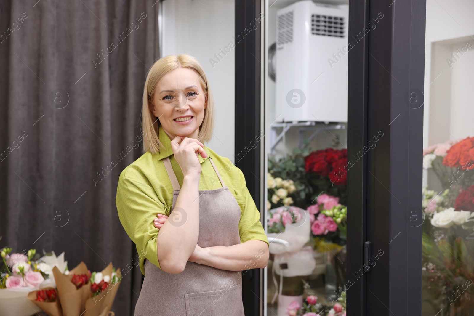 Photo of Happy business owner in her flower shop