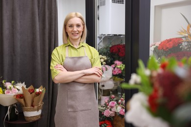 Photo of Happy business owner in her flower shop