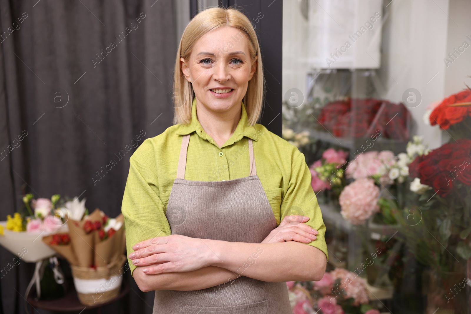 Photo of Happy business owner in her flower shop