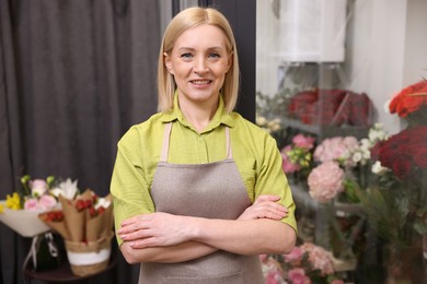 Happy business owner in her flower shop