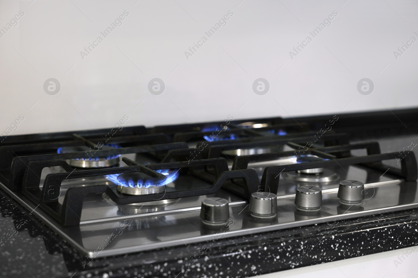 Photo of Stove with burners on counter in kitchen