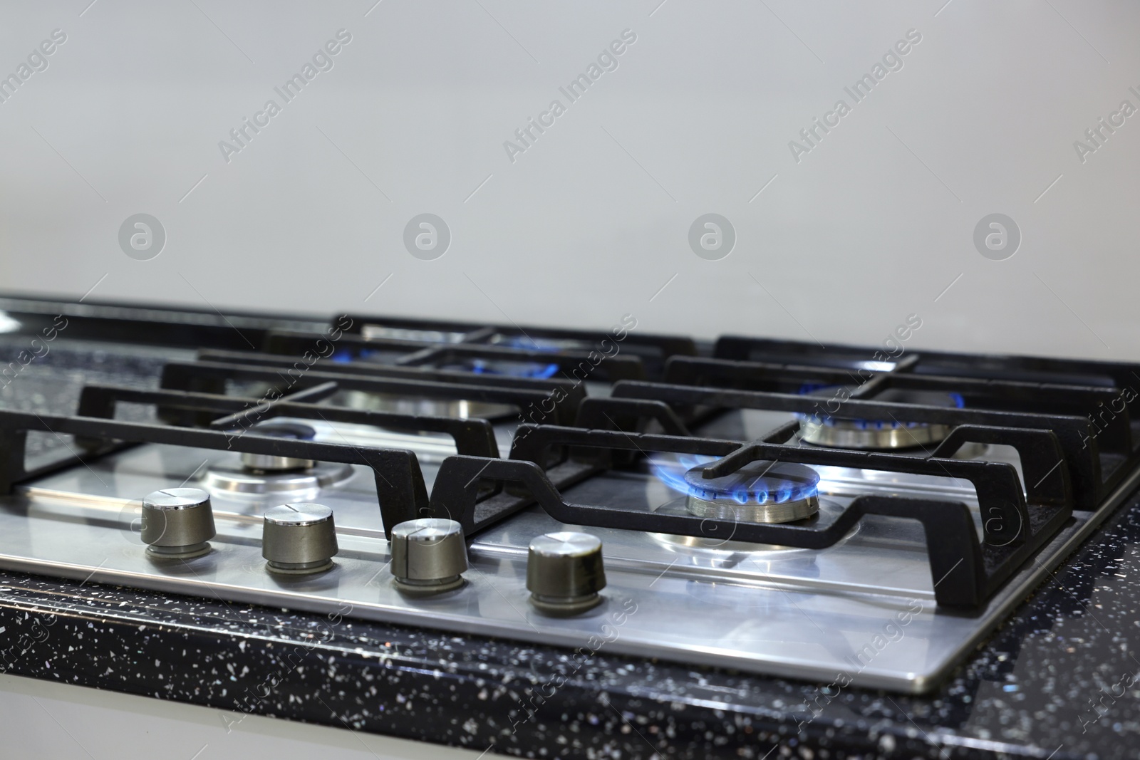 Photo of Stove with burners on counter in kitchen