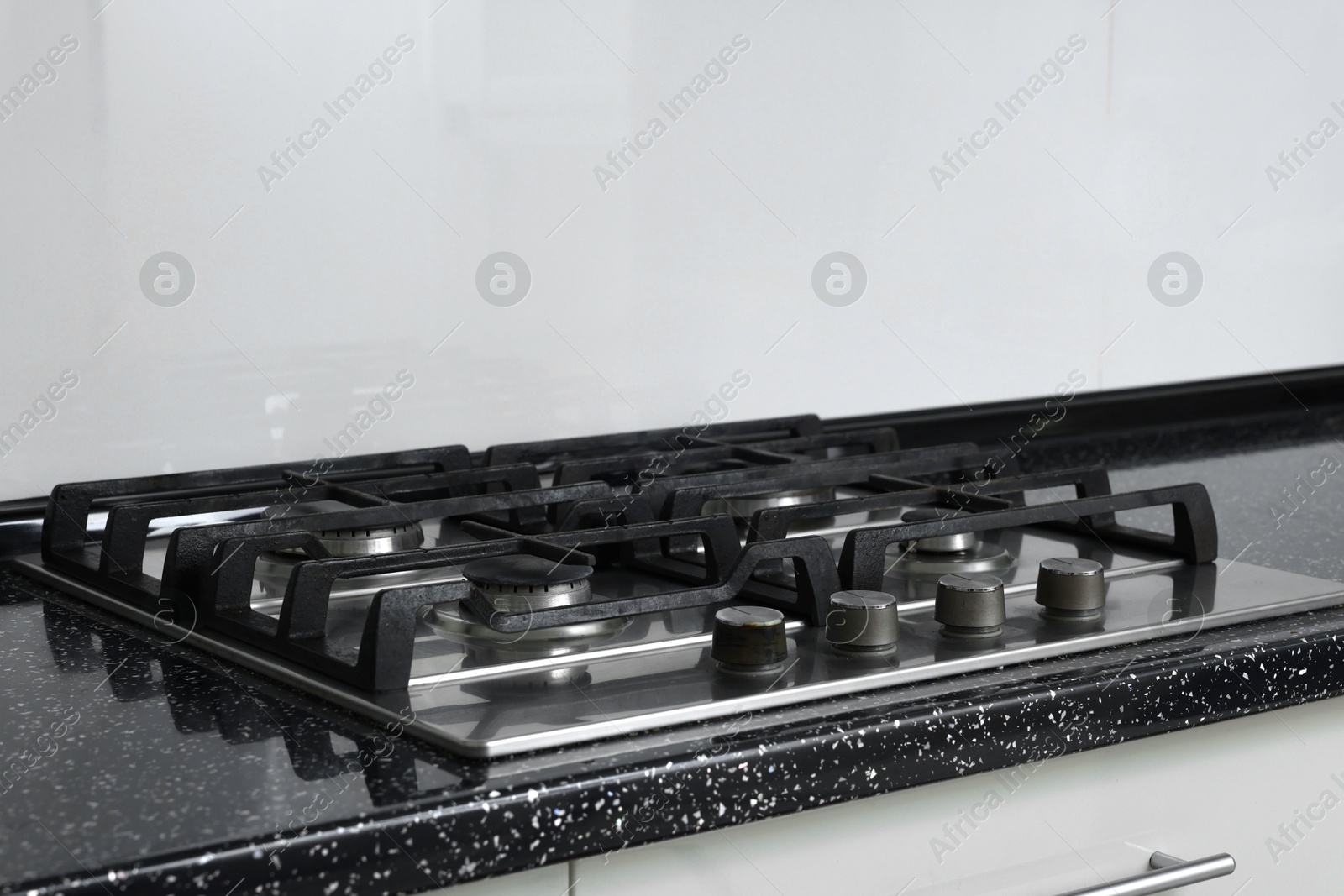 Photo of Stove with burners on counter in kitchen