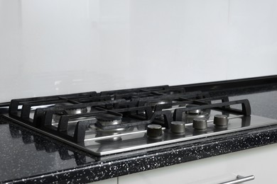 Photo of Stove with burners on counter in kitchen