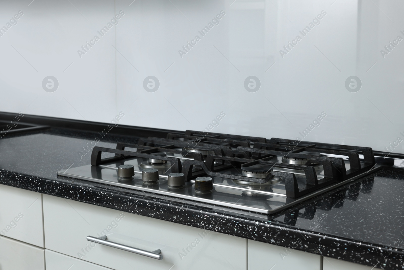 Photo of Stove with burners on counter in kitchen