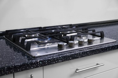 Photo of Stove with burners on counter in kitchen