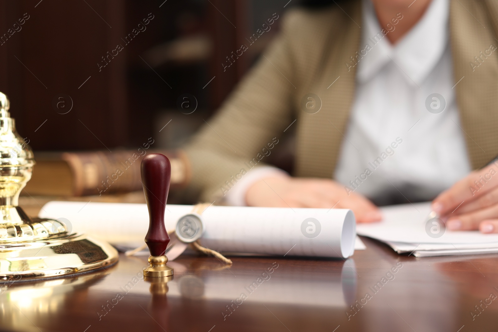 Photo of Notary working at table in office, selective focus