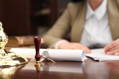 Notary working at table in office, selective focus