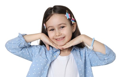 Happy little girl wearing beautiful hair accessories on white background