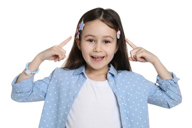 Happy little girl wearing beautiful hair accessories on white background