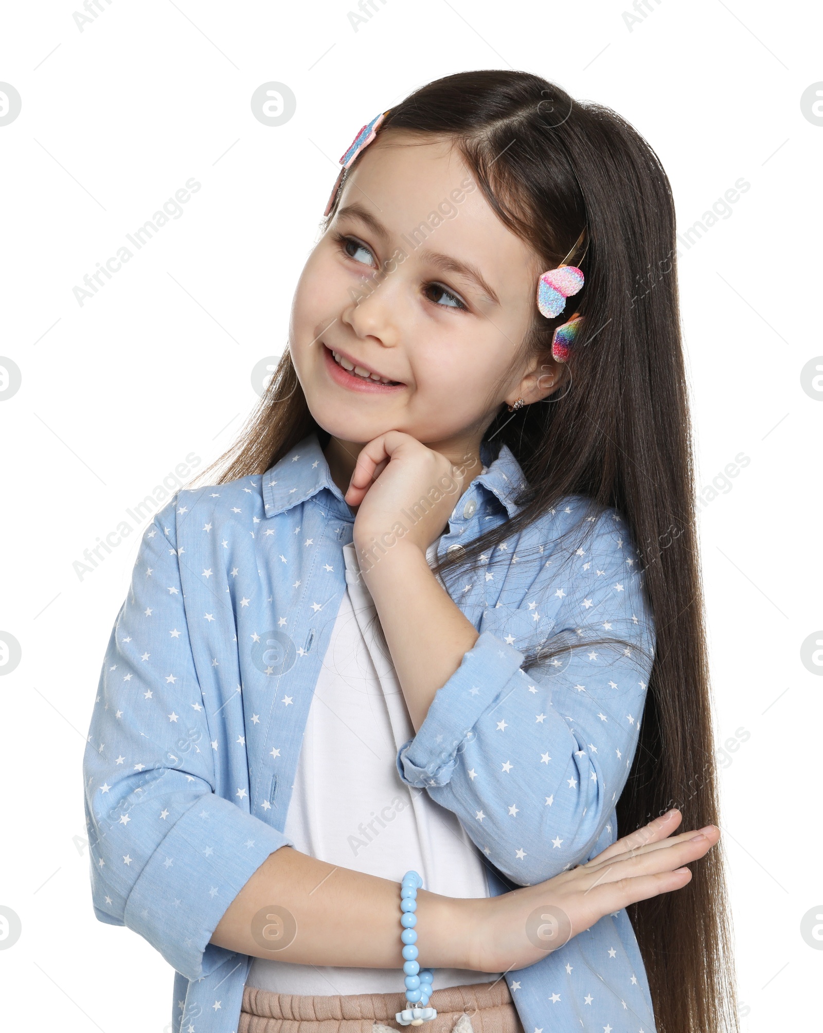 Photo of Happy little girl wearing beautiful hair accessories on white background