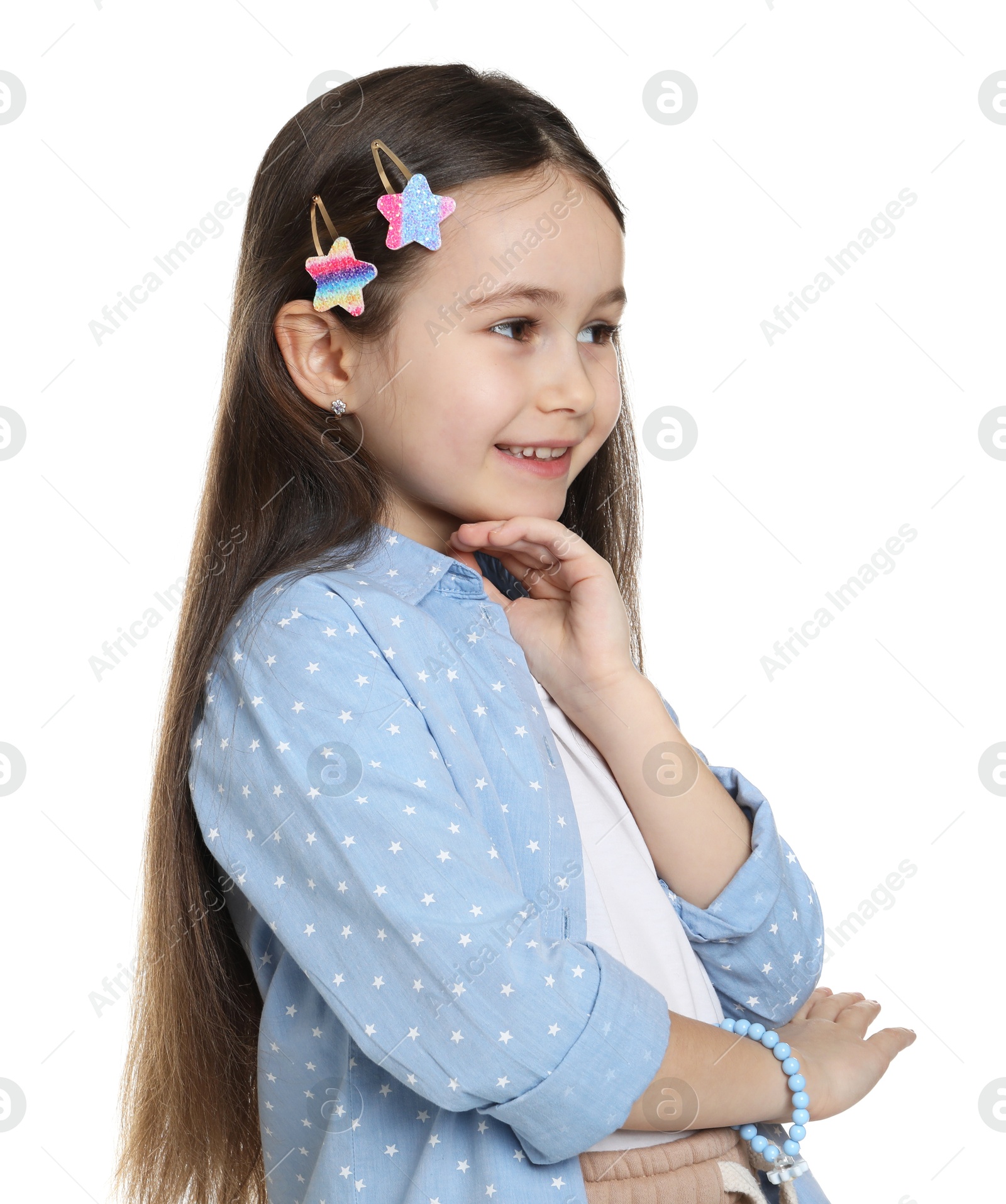 Photo of Happy little girl wearing beautiful hair accessories on white background