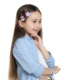 Happy little girl wearing beautiful hair accessories on white background