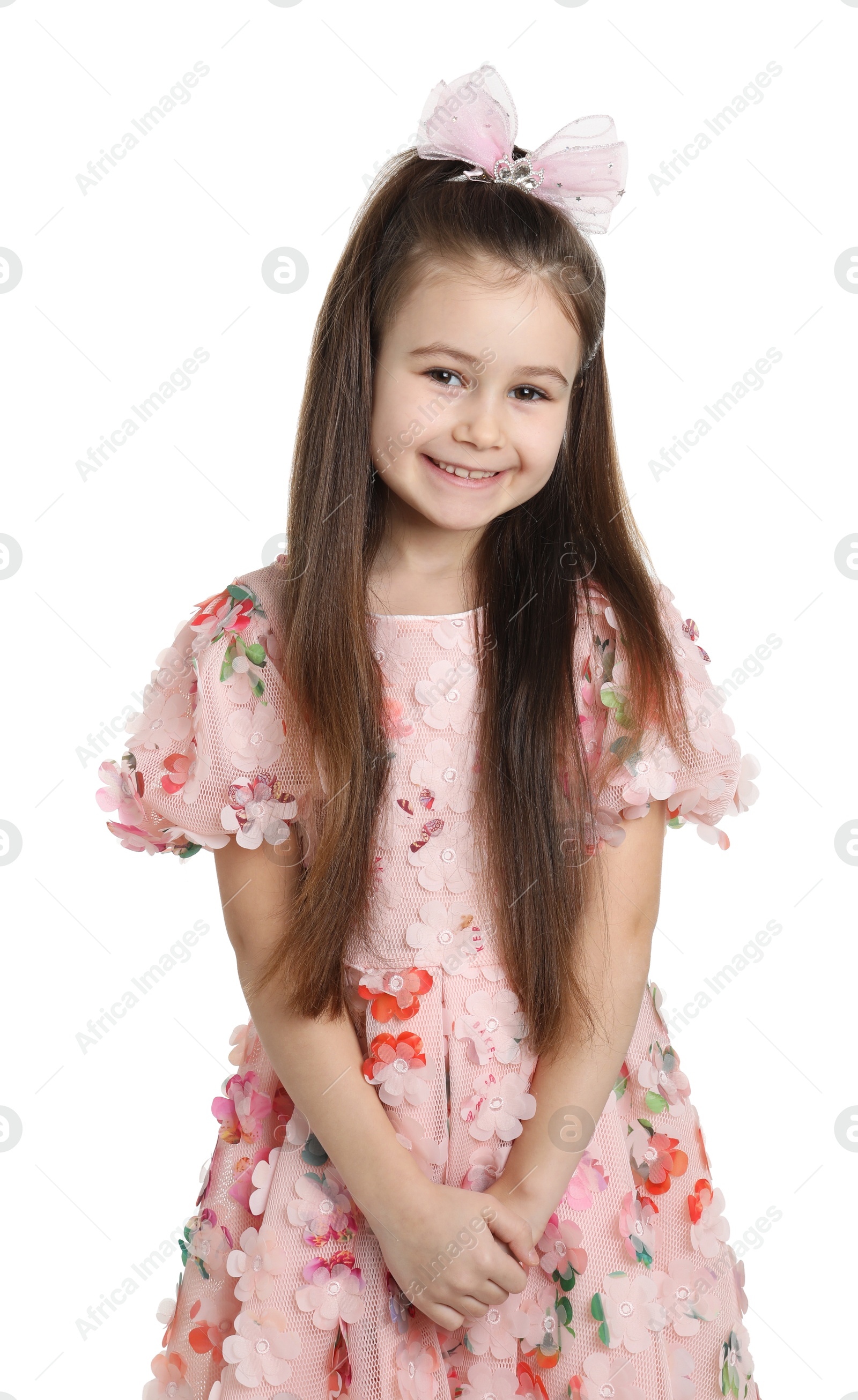 Photo of Happy little girl wearing beautiful hair accessory on white background