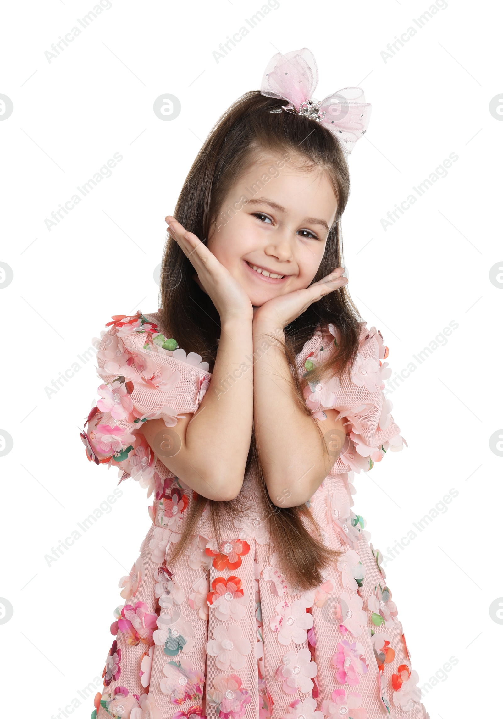 Photo of Happy little girl wearing beautiful hair accessory on white background